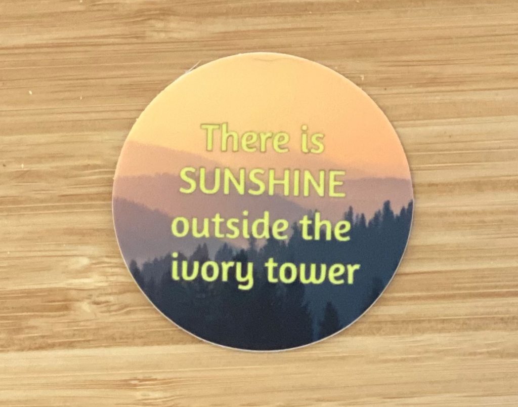 Official podcast sticker. Mountain sunrise background with text stating There is SUNSHINE outside the ivory tower